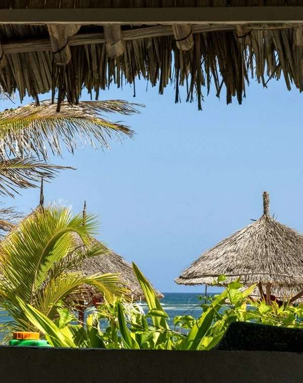 Diani beach view with huts and cool breeze